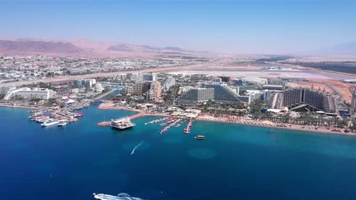 Eilat City Skyilne with Hotels boats and desert