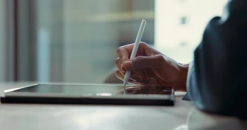 Hands, writing and stylus in office on tablet, planning or review for compliance in legal case