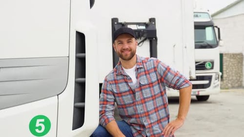Portrait of Confident Truck Driver on Parking Lot Looking at Camera Copy Space