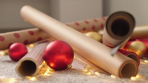 Christmas Wrapping Paper and Baubles with Twinkling Lights