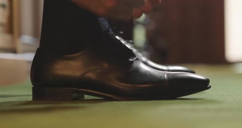 Portrait of elegant shoes and belts on a shelf of a shop (tailoring). Concept: fashion, style, mod