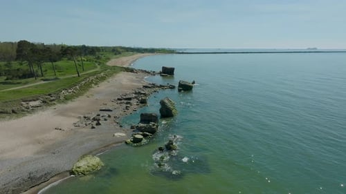 Beautiful aerial establishing view of Karosta (Liepaja) concrete coast fortification ruins, calm Bal