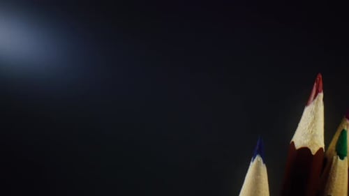 Colored Pencils Macro Shot on Dark Background