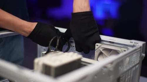 Professional Technician Male in Gloves Taking Out Fan Compartment to Perform Maintenance at Workshop