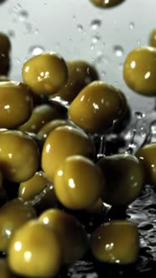 Canned Peas Fall on a Wet Table Filmed on a Highspeed Camera at 1000 Fps