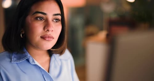 Woman, review and computer at office, night or solution for project management for overtime at media