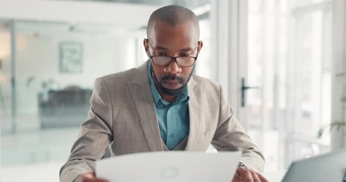 Reading, paperwork and employee with laptop, office and typing financial report on website