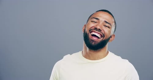 Bearded Man Smiling and Making Heart Shape
