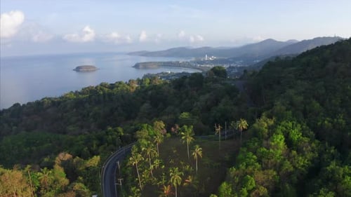 Aerial view of the tropical coastline with beaches and green lush forest. Phuket island, Thailand