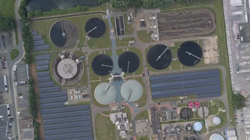 Aerial pass over sewage treatment plant with digesters, Netherlands