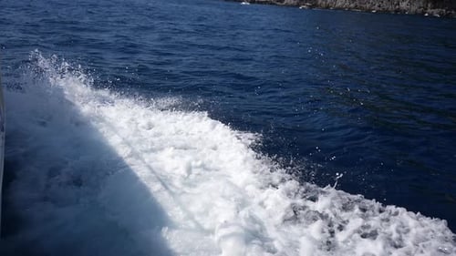 Top View of Wave Foam and Bubbles on Sea Water Surface for Travel While Sailing Wake Behind Large