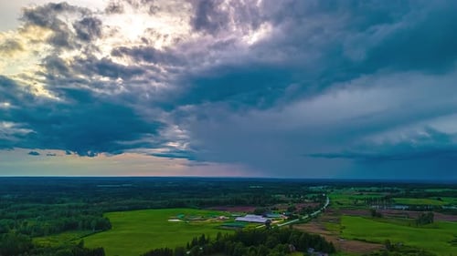 Dramatic aerial view of countryside under stormy sky