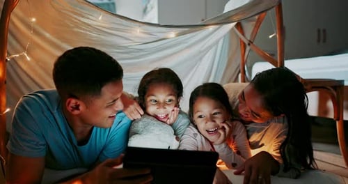 Happy Family Watching Tablet in Cozy Home Fort