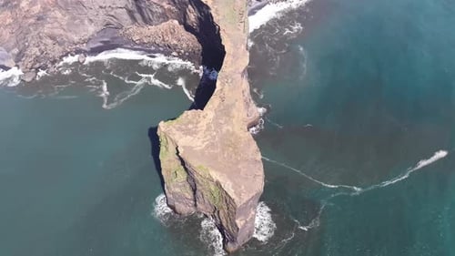 Aerial video over the cliffs of Dyrhulai, South Iceland