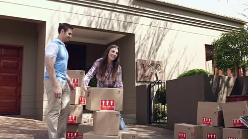 Happy Couple Moving into New Home