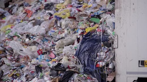 Waste truck unloading, process of managing and disposing of waste materials, transferring the waste