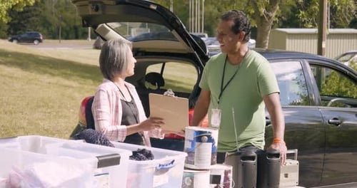 Recycling Teamwork in Sunny Parking Lot