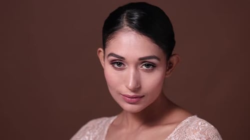 Attractive Woman with Black Hair Looking at Camera