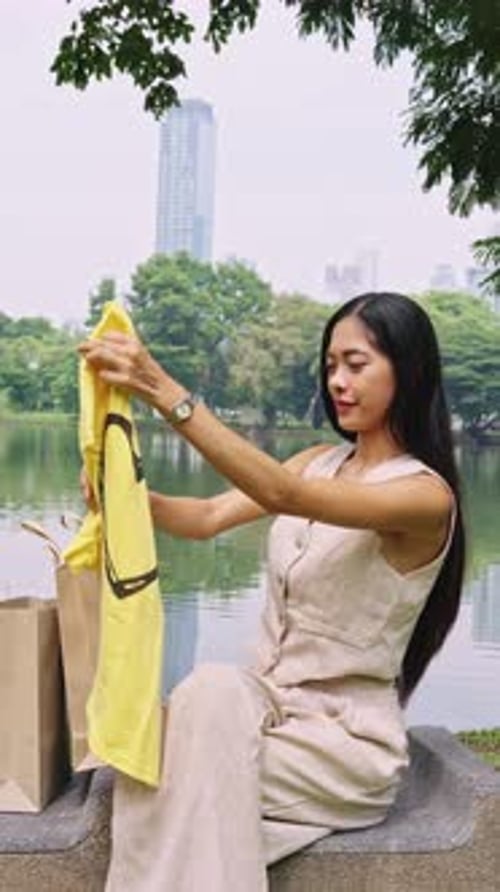 Woman Enjoying Leisurely Day in Bangkok Park By the Lake Bangkok Thailand
