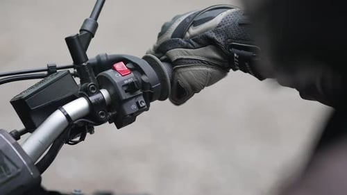 Close up of rider reving to start his motorcycle engine