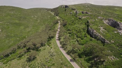 Aerial View of Motorcyclists Driving Through Mountain Road