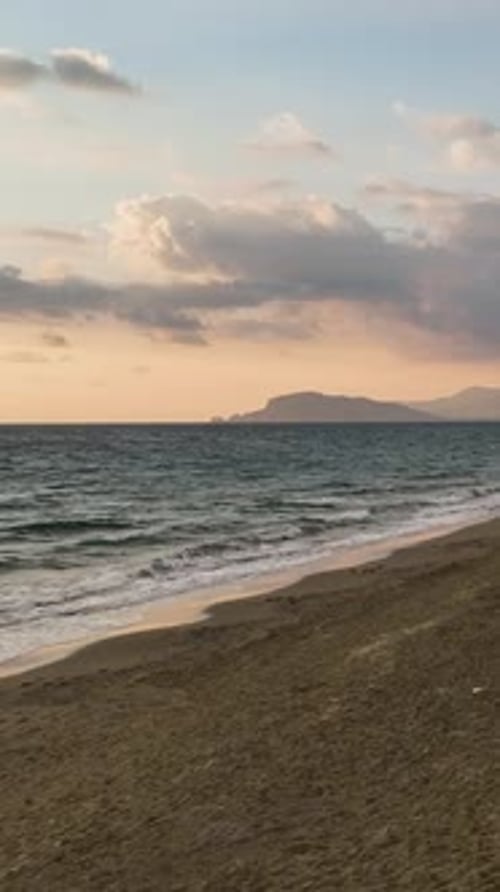Vertical Video Aerial Evening Promenade People Enjoying a Magical Beach at Sunset
