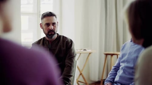 Group Attending Meeting Sitting in a Circle