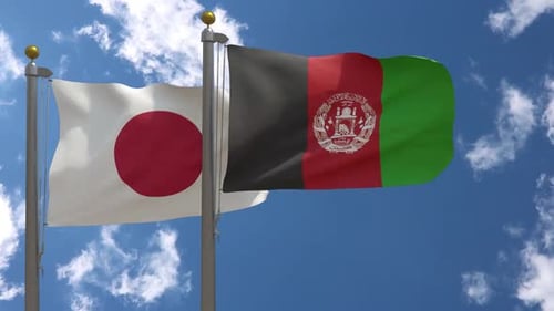 Japan and Afghanistan National Flags Waving on Flagpoles