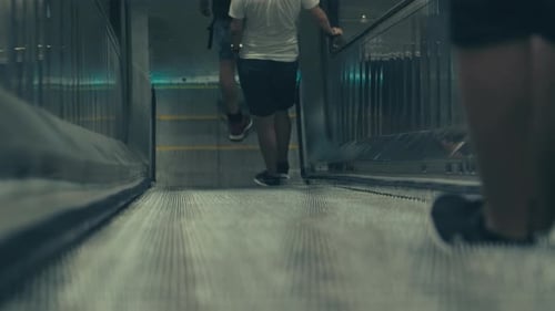 A Shot Of People On A Downwards Moving Escalator To The Subway Of Stockholm,Sweden. Filmed In SLOW M