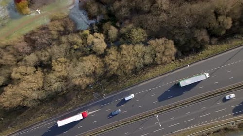 Lorries, Cars and Vehicles Driving on a UK Motorway Aerial View