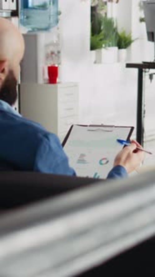 Vertical Video Startup Analyst Comparing Files