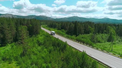 Top View of Truck Driving Along Highway on Summer Day Scene White Truck is Driving on Country