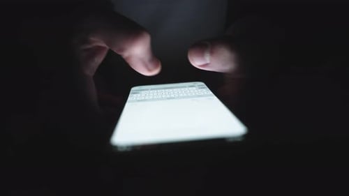 Hands of Man Chatting on the Mobile Phone Typing Message Slow Motion