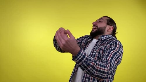Portrait Expressive Man Gesturing Scolding Isolated on Yellow Indoors