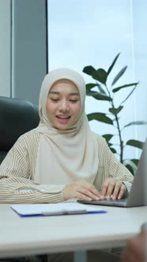 Smiling Young Woman Meeting Business Partner at Office