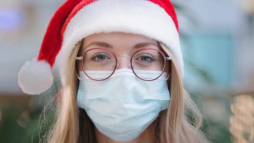 Close Up Female Portrait Caucasian Woman Lady Girl Nurse Doctor Wearing Red Santa Christmas Hat Cap