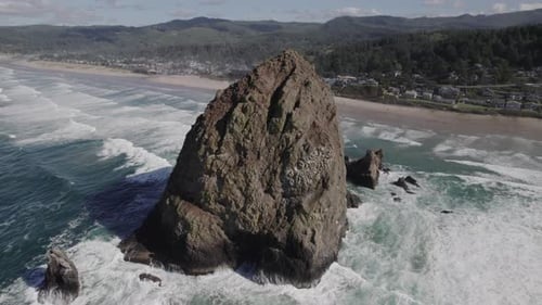 Haystack Rock towering over the Pacific Coastline