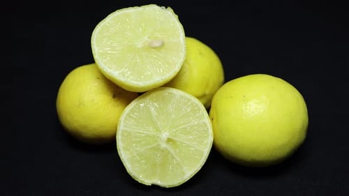 fresh Juicy Lemon Sliced Close-Up on Black Background studio shot on