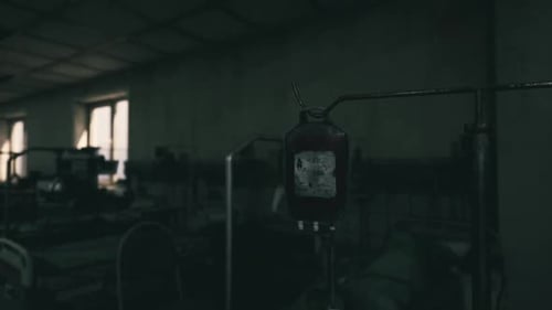 Grimy Hospital Room with Medical Equipment During a Dim Evening