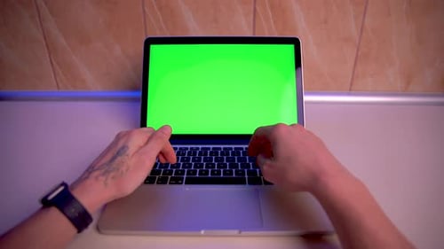 Man Using Chroma key screen laptop computer on desk at kitchen stock video