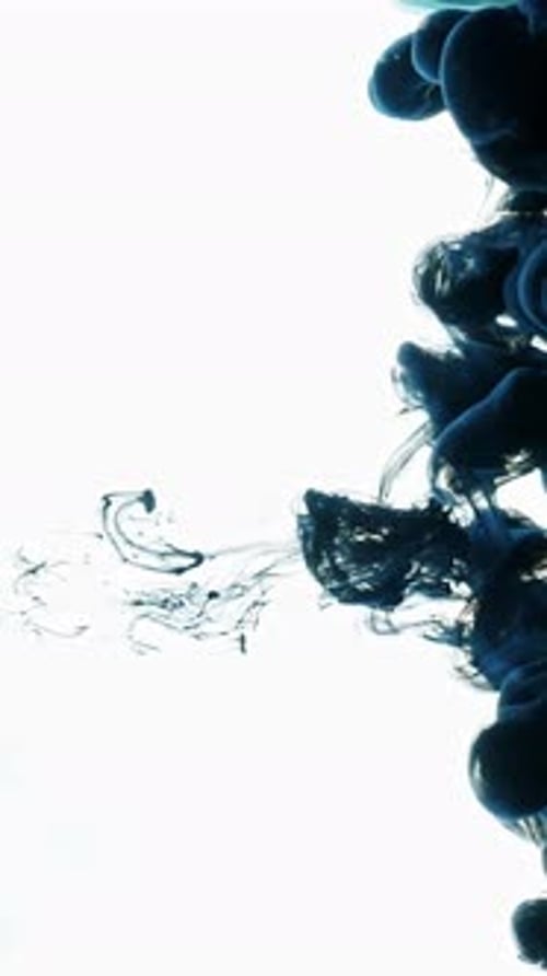 Abstract Dark Blue Ink Flowing in Water