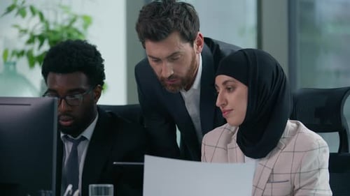 Diverse Business Group Discuss Project in Office African American Caucasian Businessmen