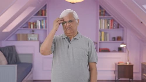 Stressed and tensed Indian old man