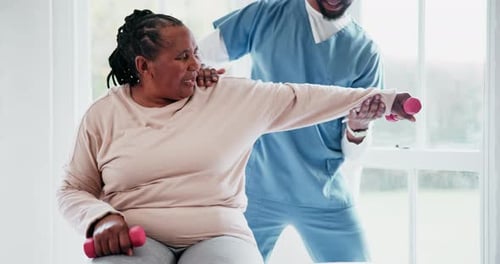 Woman Doing Arm Exercises with Physical Therapist