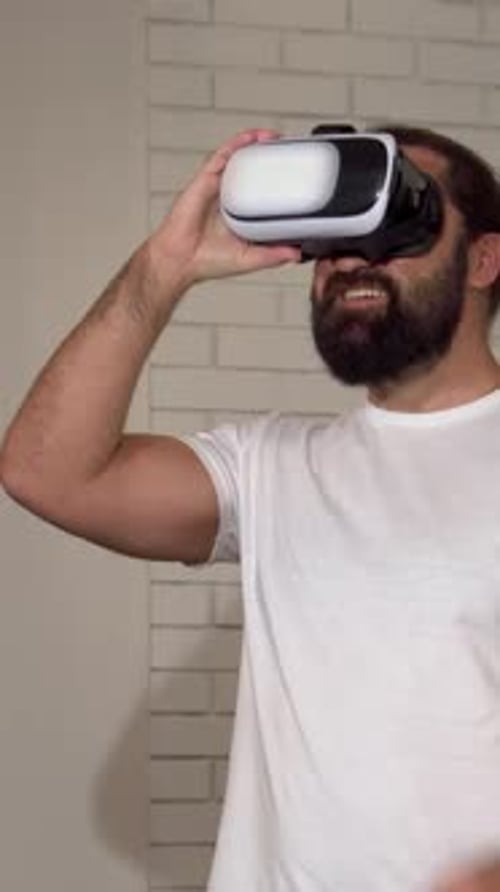 Adult Man Using Virtual Reality Headset Indoors