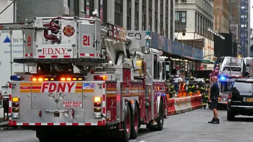 NEW YORK - OCTOBER 10, 2014: a Fire Truck and Firefighters On