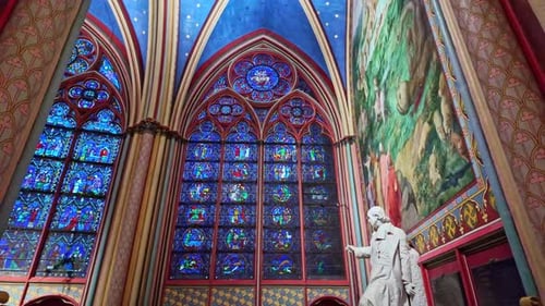 Stunning stained-glass interior of a historic Notre Dame cathedral with high vaulted ceilings and mu