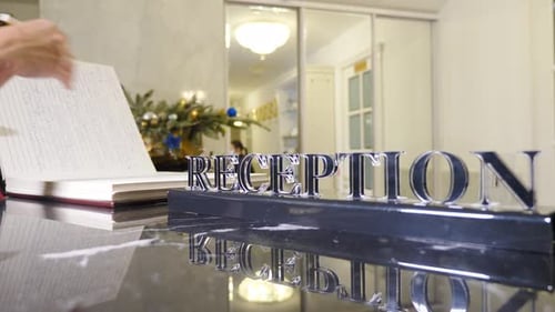 Hotel Reception Female Hands at Hotel Reception for Check in Registration and Hospitality Service