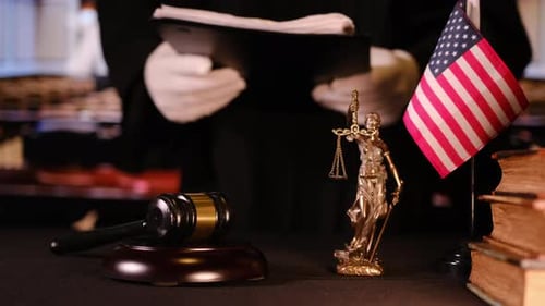 American Justice Concept with Gavel Statue and Flag