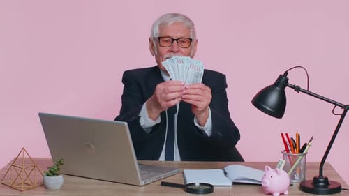 Senior Business Office Man Analyzes Financial Charts Celebrate Success Win at Home Workplace Desk